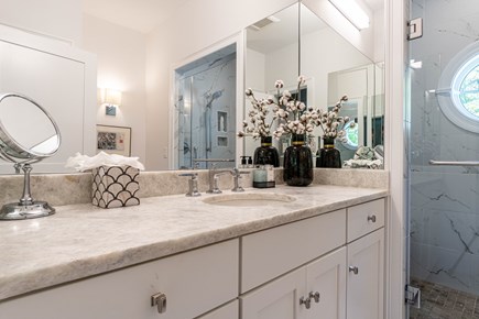 East Falmouth Cape Cod vacation rental - First floor primary bathroom suite with tiled walk in shower
