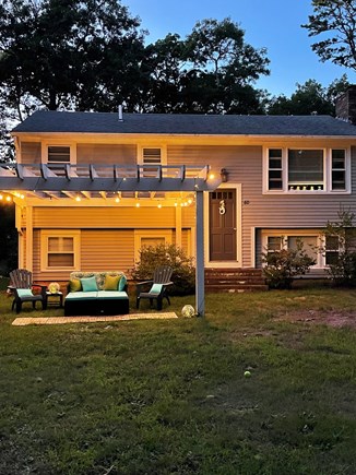 EASTHAM Cape Cod vacation rental - New lighting for the pergola and an outdoor couch!