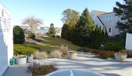 Harwich Port Cape Cod vacation rental - Large deck facing the yard that leads to the water