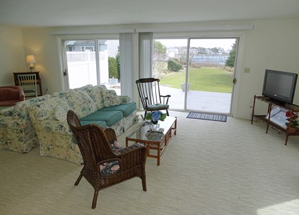 Harwich Port Cape Cod vacation rental - Living room with TV, slider to deck