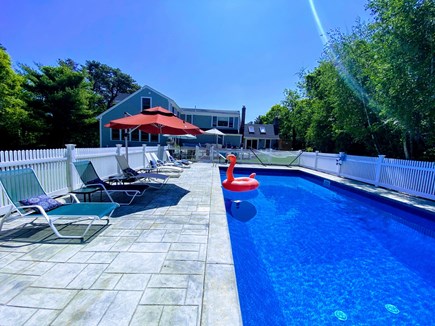 East Orleans Cape Cod vacation rental - Pool Deck. Lounge Chairs. Umbrellas. Dining Table. Toy Bin.