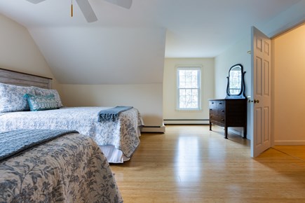 Chatham Cape Cod vacation rental - Upper level bedroom 2 with two queens and ceiling fan, window AC