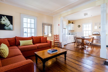 Provincetown Cape Cod vacation rental - Living room with large sectional opens into kitchen/dining
