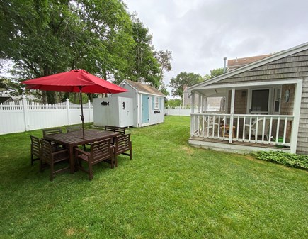 West Dennis Cape Cod vacation rental - Fenced-in back yard perfect for family time and outdoor dinners