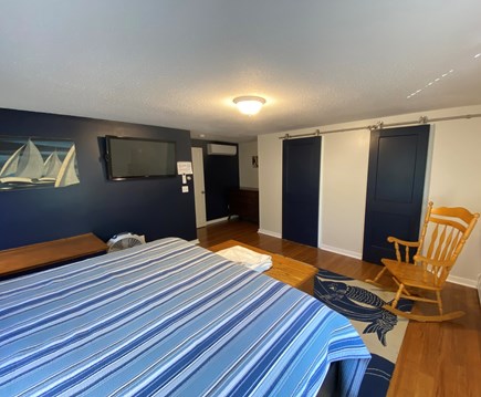 West Dennis Cape Cod vacation rental - Open king bedroom with a walk-in closet, TV, and en suite