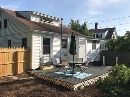 West Dennis Cape Cod vacation rental - Private rear yard, deck, seating area, outdoor shower and grill.