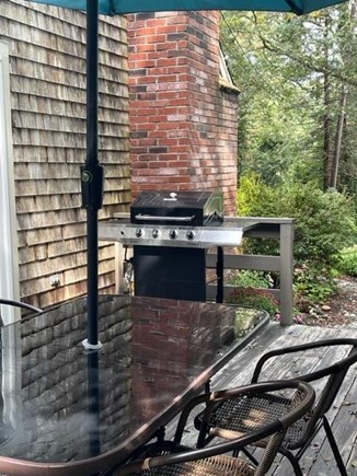 Eastham, Close to bay & ocean beaches! Cape Cod vacation rental - Gas grill. An additional table (not shown) allows seating for 8
