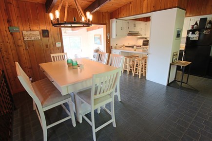 Wellfleet Cape Cod vacation rental - Dining area and kitchen, step down to the living room and master