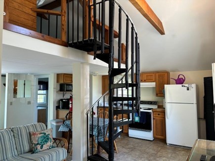 Wellfleet Cape Cod vacation rental - Spiral staircase to loft and view of kitchen