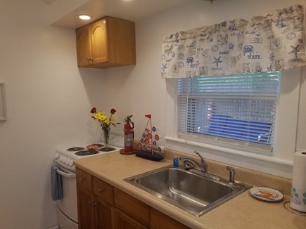 Dennis Port Cape Cod vacation rental - Kitchen full sink and 5 burner stove with oven, vaulted ceiling