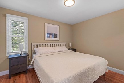 Dennis Port Cape Cod vacation rental - One of three gorgeous bedrooms on first level - Primary Bedroom with a king bed with private bath