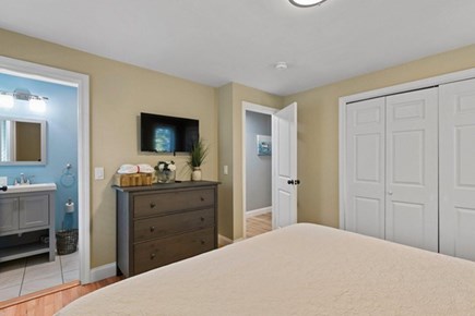 Dennis Port Cape Cod vacation rental - One of three gorgeous bedrooms on first level - Primary Bedroom with a king bed with private bath