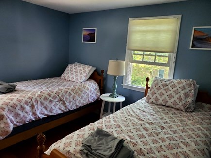 N. Eastham Cape Cod vacation rental - Second floor bedroom with two twin beds and bureau with mirror.