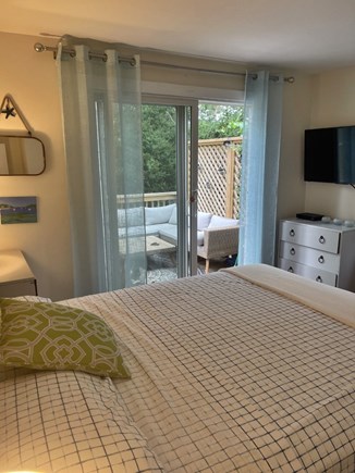 Hyannisport Cape Cod vacation rental - Bedroom with smart flat screen and sliders to deck