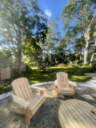 Hyannisport Cape Cod vacation rental - Spacious private yard and relaxing  around the Adirondack chairs