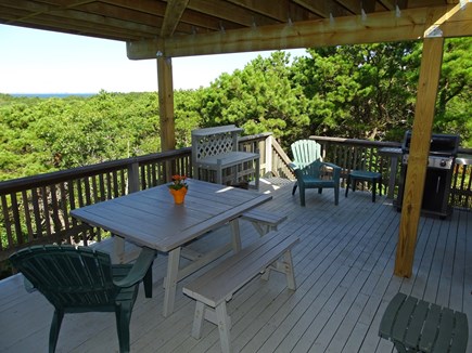 South Truro Cape Cod vacation rental - Middle deck area, off dining room, with grill and water views