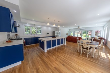 Steps from Dennis Village and  Cape Cod vacation rental - Great room with fully epuiped kitchen, living space and dining.