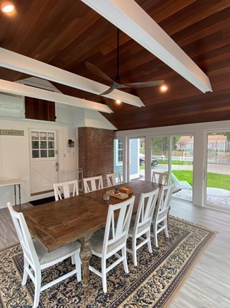 South Yarmouth Cape Cod vacation rental - Fulling screened porch offers large gathering for meals or coffee