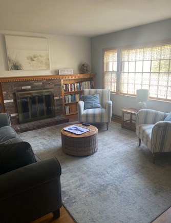 Dennis Cape Cod vacation rental - Sunny living room area with Smart TV and lots of books and games