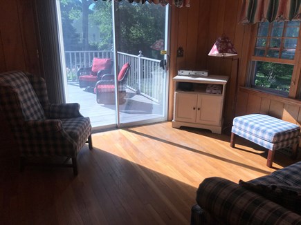 Dennis Cape Cod vacation rental - Comfortable den with slider leading out to large deck.