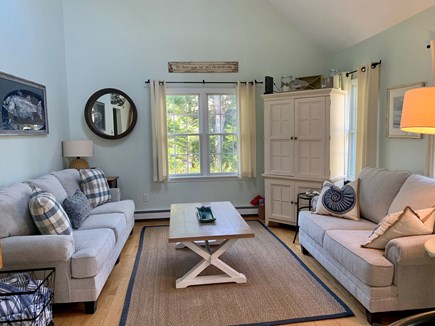 Brewster Cape Cod vacation rental - First floor living room/sitting area with TV (cabinet)