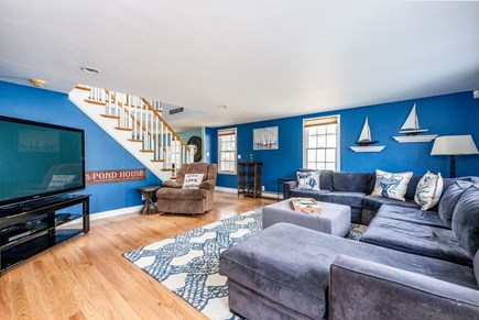 South Yarmouth Cape Cod vacation rental - 1st floor main living room with large sectional sofa and TV
