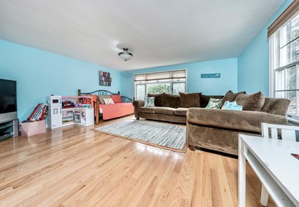 South Yarmouth Cape Cod vacation rental - Spacious playroom w sectional sofa, a daybed, TV, & lots of toys