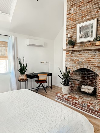 Harwich Port Cape Cod vacation rental - Primary bedroom with cute desk area & beautiful fireplace