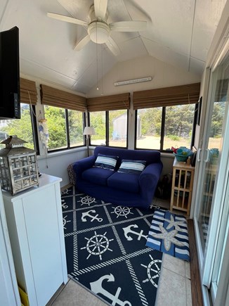 West Dennis Cape Cod vacation rental - Sunroom with TV, game cabinet and washer/dryer