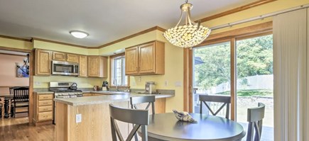 Onset MA vacation rental - Eat-in-kitchen with sliders to deck and large DR (sits 8-10)