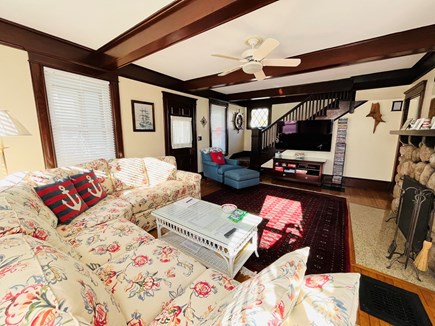 Falmouth Heights Cape Cod vacation rental - Living room with O-led TV, and staircase to 2nd floor.