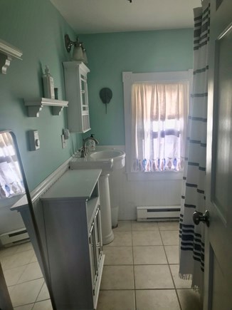 North Eastham Cape Cod vacation rental - Bathroom with shower and clawfoot tub.