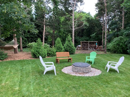 Orleans- East Orleans Cape Cod vacation rental - Back Yard with fire pit and hammock