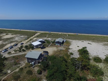 Truro Cape Cod vacation rental - Aerial photo of the cottage and beach in August