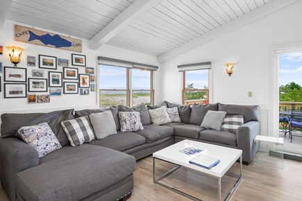 Truro Cape Cod vacation rental - Main living area with dining and sliders onto deck