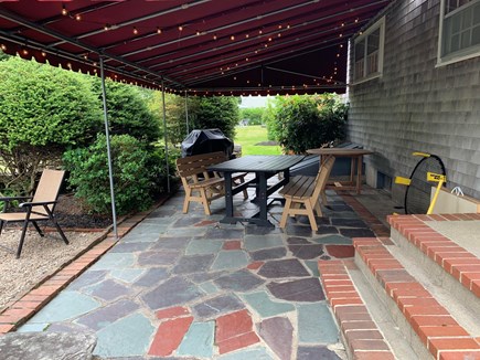 Falmouth Village Cape Cod vacation rental - Covered porch w/ lights - perfect for nights and rainy days.