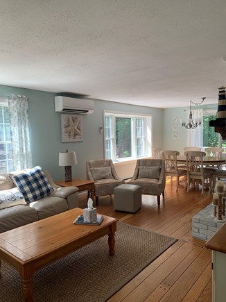 Eastham Cape Cod vacation rental - Living room and dining room open to deck area.