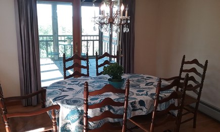 Wellfleet Cape Cod vacation rental - Dining with views that opens to screened porch & deck beyond