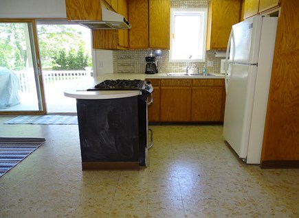 East Falmouth Cape Cod vacation rental - Main floor kitchen part of open living / dining, slider to deck