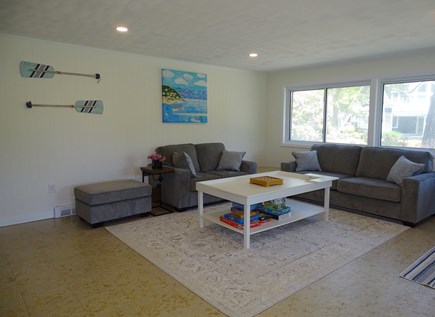 East Falmouth Cape Cod vacation rental - Main floor living room w/ TV, new couches, opens to dining area