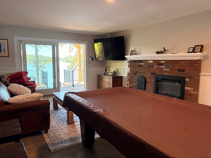 Harwich Cape Cod vacation rental - Lounge area with pool table leading to patio area