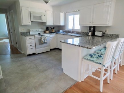 Brewster Cape Cod vacation rental - Social kitchen is equipped with everything you'll need. Note counter seating -- perfect for kids snacks or lunch.