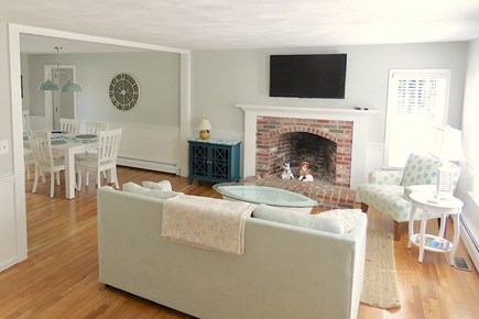 Brewster Cape Cod vacation rental - Living room walks into dining area (at left) just off the kitchen.