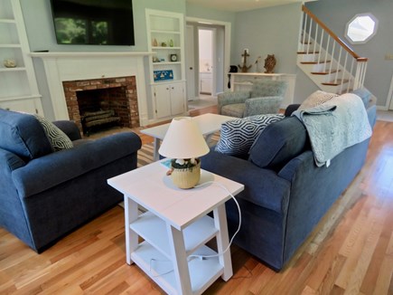 Brewster Cape Cod vacation rental - Family room with stairs to additional sleeping space.