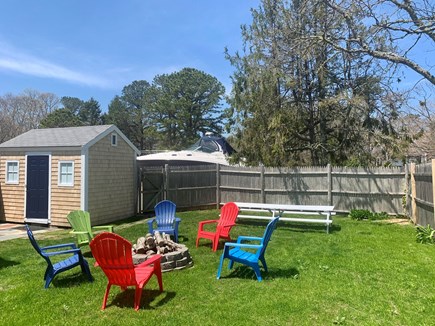 Harwich Port  Cape Cod vacation rental - Private fenced back yard with fire-pit, picnic table and grill.