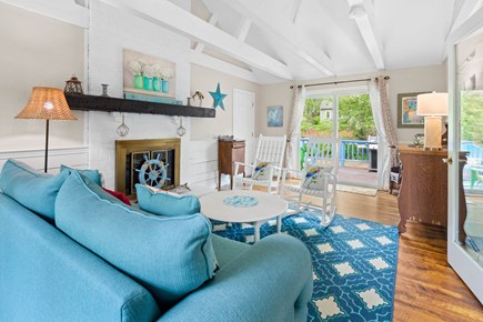 Harwich Cape Cod vacation rental - Sitting room with access to back patio and window AC