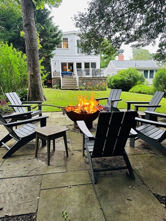 Marion MA vacation rental - New - brand new bluestone fire pit area with 6 Adirondack chairs