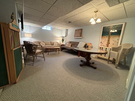 Popponesset Cape Cod vacation rental - Downstairs game room, with couch, futon, smart tv, assorted games