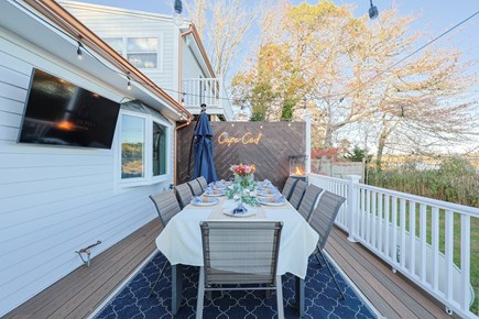 Dennis Cape Cod vacation rental - 10 Person dining table and TV with YoutubeTV