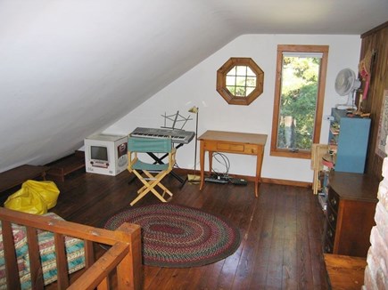 Truro Cape Cod vacation rental - The upstairs alcove; board games, music and kids' toys